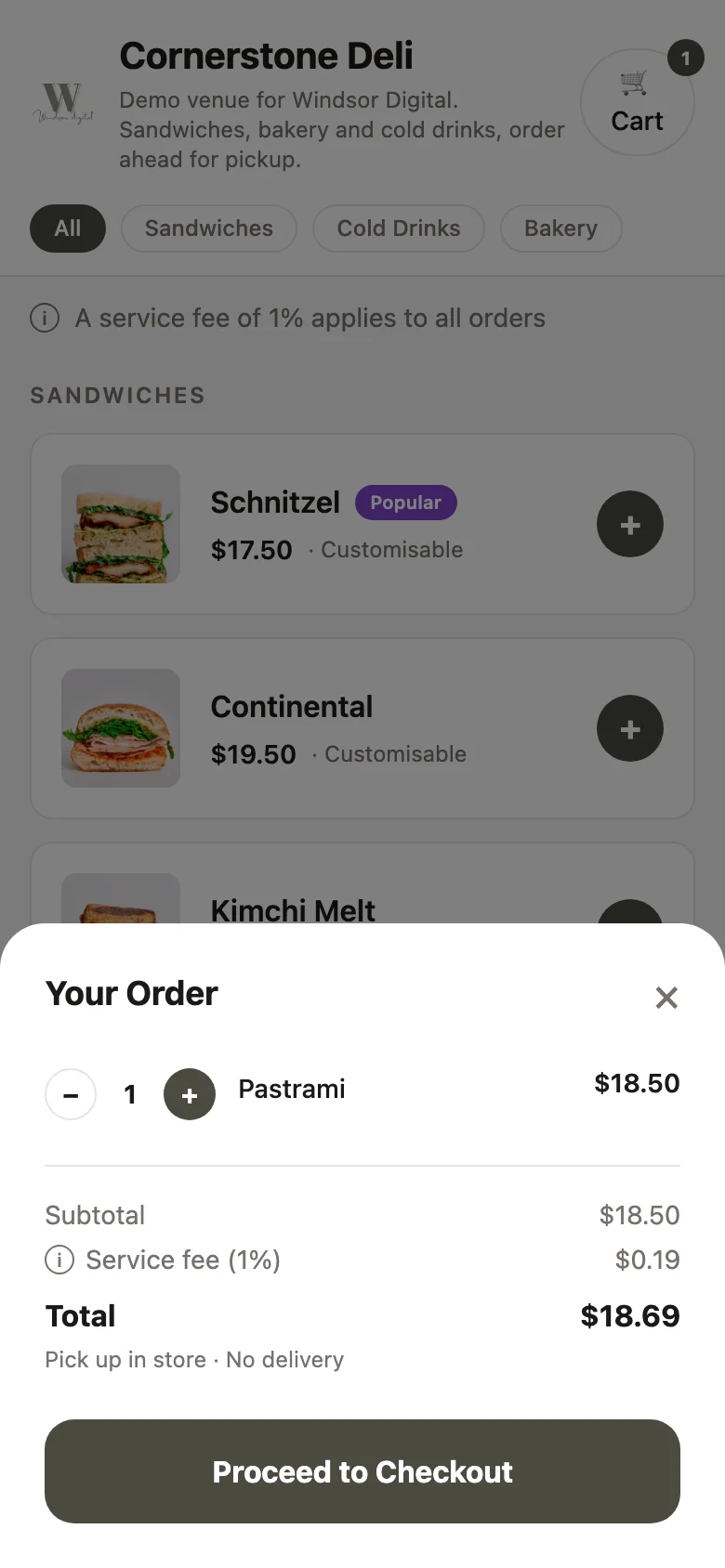 A live Windsor Digital ordering page on a phone. The menu says a service fee of 1% applies to all orders, and the cart shows Subtotal $18.50, Service fee (1%) $0.19, Total $18.69.
